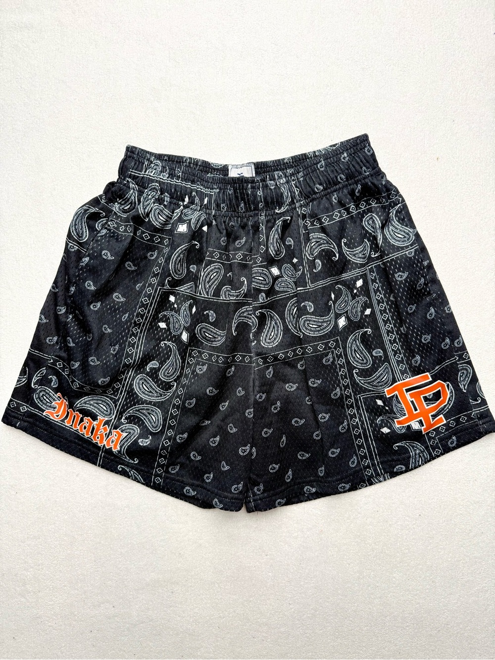 Inaka Power Black Bandana-Print Boxing Shorts with Orange Logo Accents